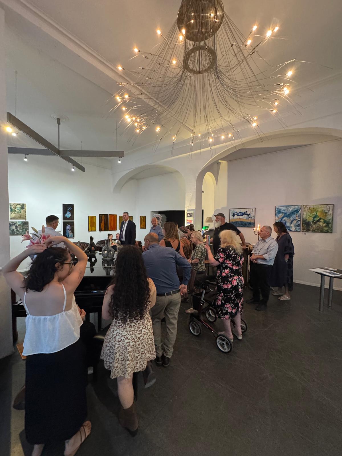 Visitors viewing the works during the exhibition opening in Berlin